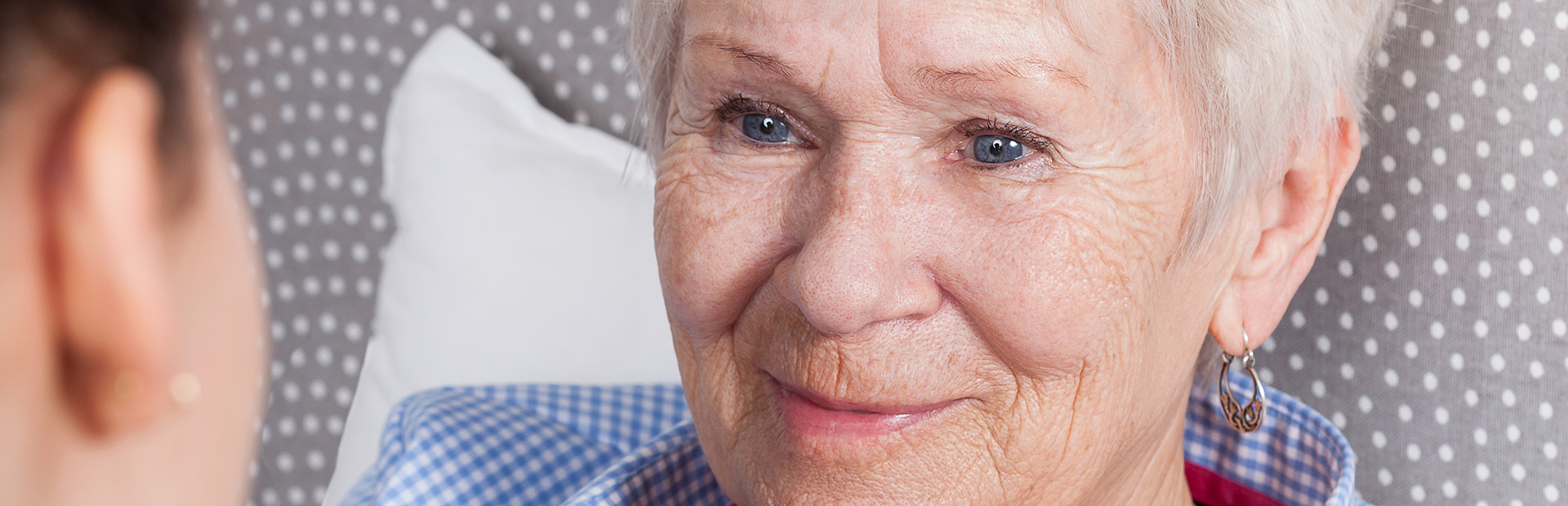 Nurse comforting elderly woman